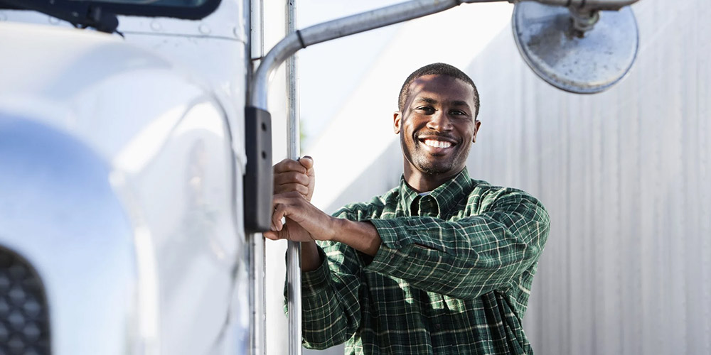 Innovative Learning Solutions Website Image African Truck Training Man Outside Truck